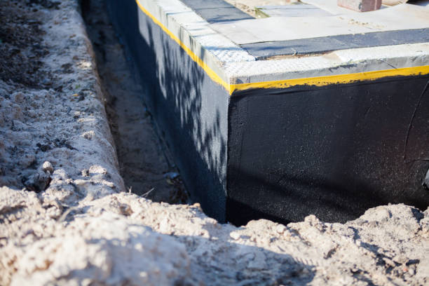 Professional Exterior Waterproofing technician working in Columbus, KS